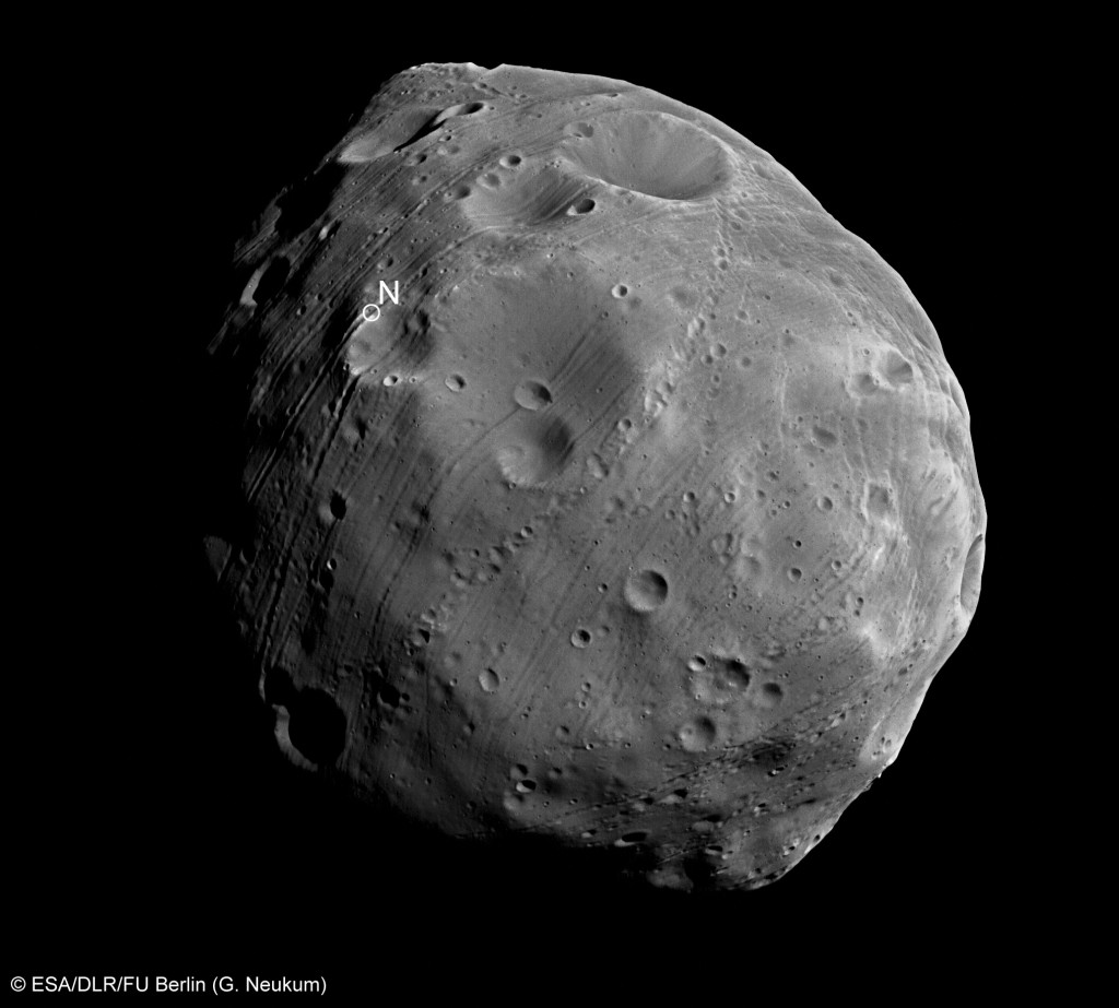 Close up of Martian moon Phobos. © ESA/DLR/FU Berlin (G. Neukum). This particular image was acquired on 28 July 2008 with the nadir channel of the HRSC. Mars Express was 351 km from Phobos at the time of exposure and the resolution is 14/pixel. The image shows the northern hemisphere of Phobos marked with innumerable meteor craters. The sign N indicates the location of the North Pole. 