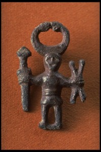 17520 Bronze figure with Horns, weapons and crossed sticks. Kungsängen, Uppland, Sweden. Iron Age