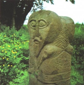 A Celtic idol with two faces (Janus form) in Caldragh graveyard on Boa Island in Lower Lough Erne, Co. Fermanagh from the early Celtic period in Ireland (probably middle of first millennium BC)