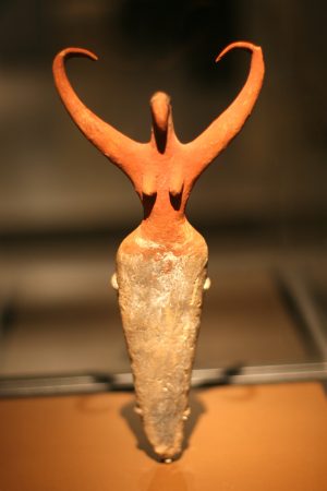 Terracotta painted figurine from Egypt's Predynastic Period With raised arms bird horn