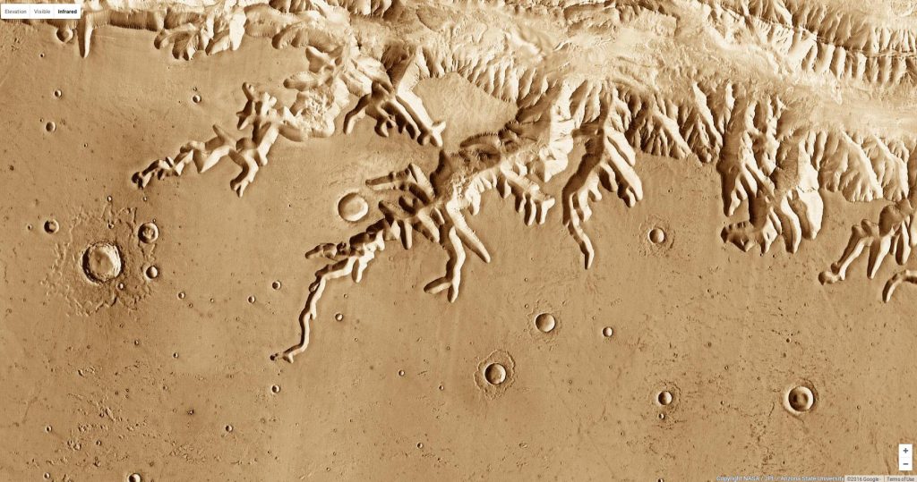 The system of V-shaped tributary canyons along the south rim of Ius Chasma on Mars. See them on Google Mars. © NASA / JPL / MSSS / Arizona State University